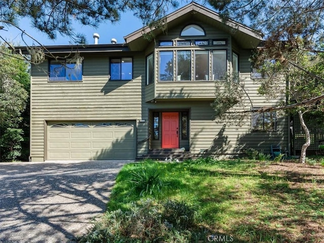 view of front facade featuring driveway and an attached garage