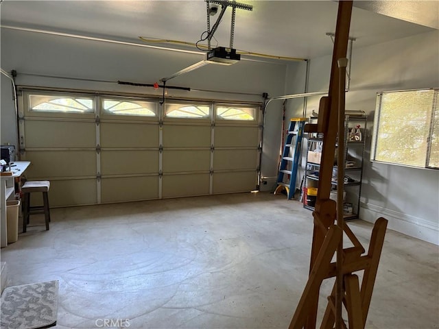 garage featuring baseboards and a garage door opener