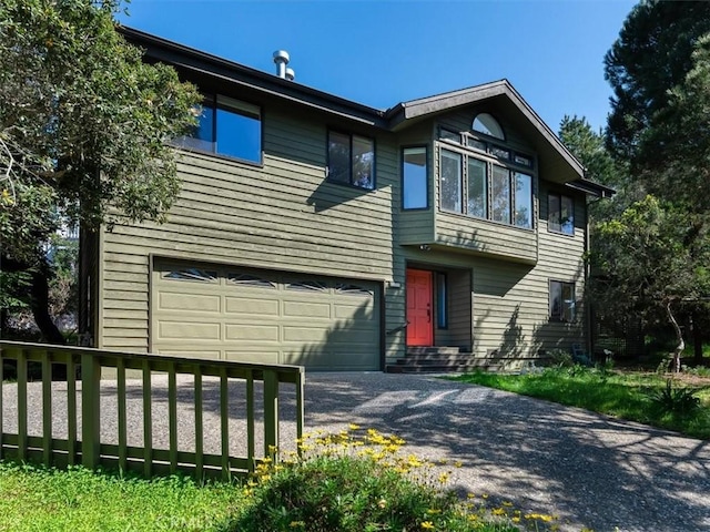 view of front of property featuring an attached garage and driveway