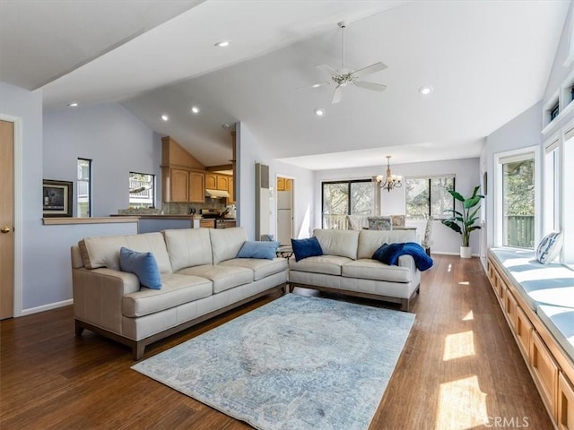 living area featuring high vaulted ceiling, recessed lighting, baseboards, and wood finished floors