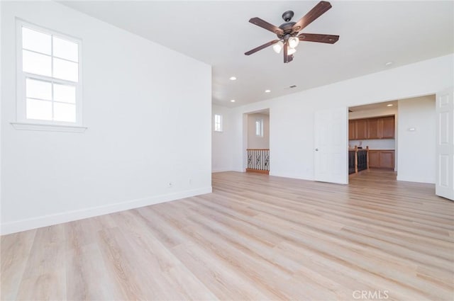 unfurnished living room with recessed lighting, baseboards, light wood-style floors, and ceiling fan