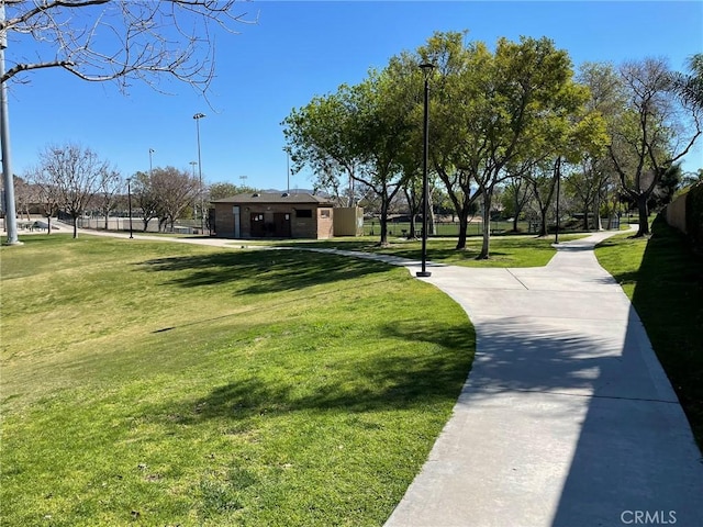 view of home's community with a lawn