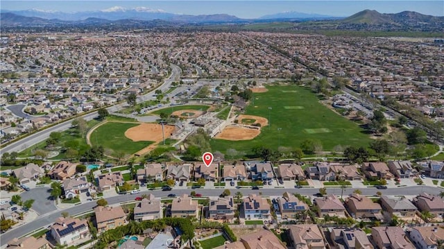 birds eye view of property featuring a mountain view and a residential view