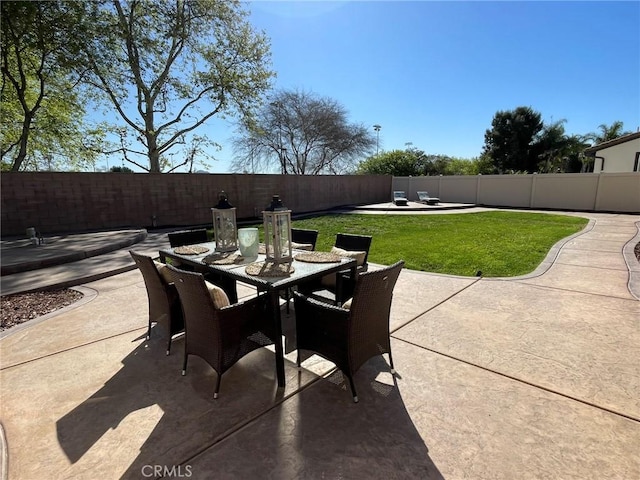 view of patio / terrace with outdoor dining space and a fenced backyard