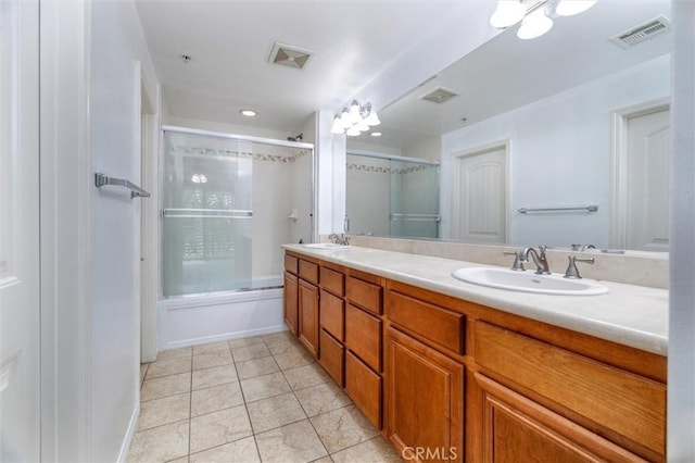 full bath with double vanity, tile patterned flooring, visible vents, and a sink