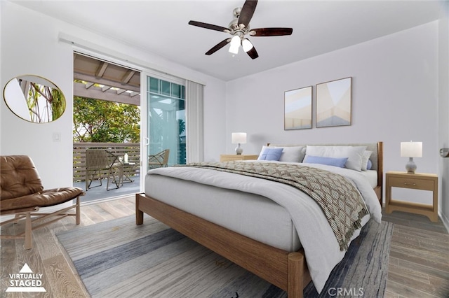 bedroom with ceiling fan, wood finished floors, and access to exterior