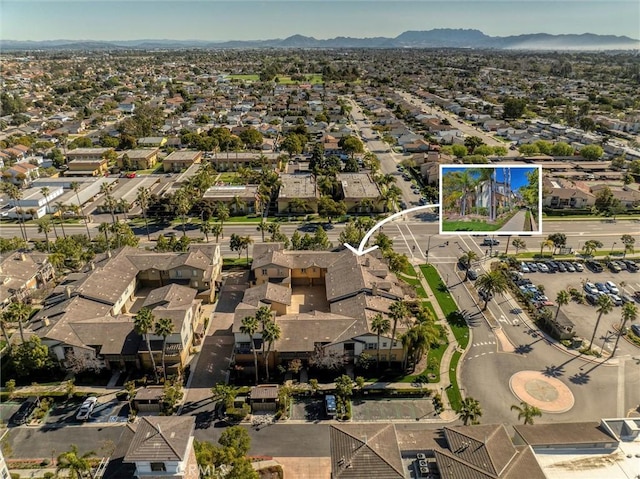 birds eye view of property featuring a residential view and a mountain view