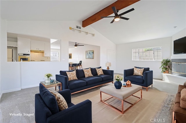 living area with visible vents, lofted ceiling with beams, carpet, baseboards, and ceiling fan