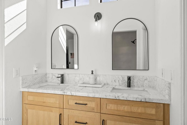 bathroom with double vanity and a sink