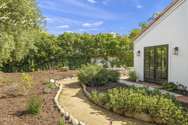 view of yard featuring french doors