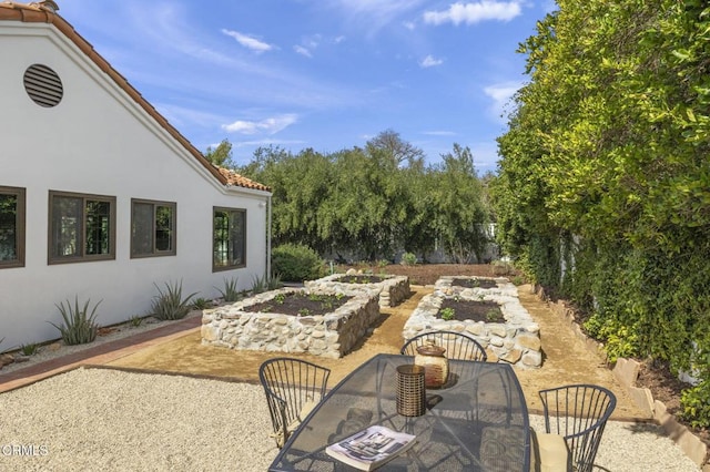 view of patio featuring outdoor dining space