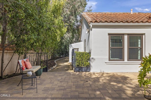 view of patio / terrace featuring fence