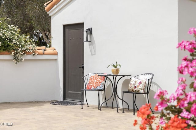 doorway to property with stucco siding