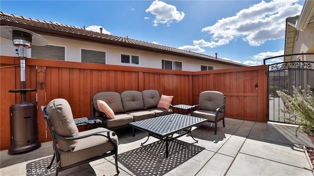 view of patio / terrace with fence private yard, a gate, and an outdoor hangout area