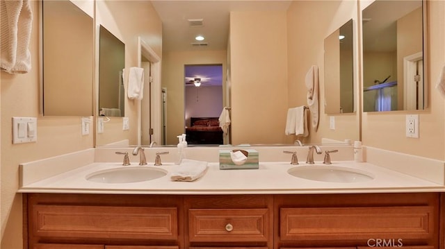 ensuite bathroom with double vanity, visible vents, a sink, and ensuite bathroom