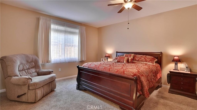 bedroom with a ceiling fan, carpet, and baseboards