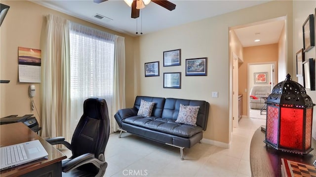 office area with ceiling fan, light tile patterned floors, visible vents, and baseboards