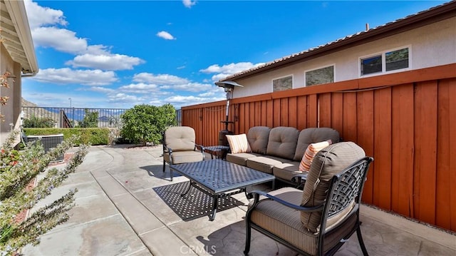 view of patio / terrace with a fenced backyard, central AC unit, and an outdoor hangout area