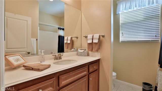 full bath featuring curtained shower, vanity, toilet, and tile patterned floors