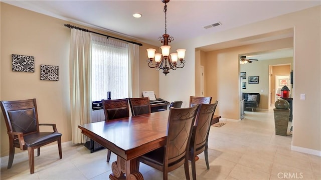 dining area featuring baseboards, visible vents, and a ceiling fan