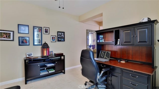 office space featuring light tile patterned floors and baseboards