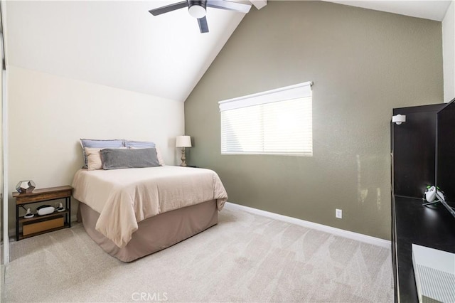 carpeted bedroom with a ceiling fan, baseboards, and vaulted ceiling