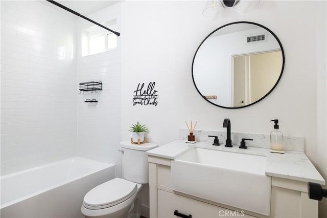 bathroom with vanity, shower / tub combination, toilet, and visible vents