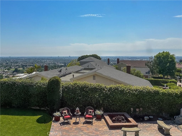 view of yard with an outdoor fire pit and a patio area