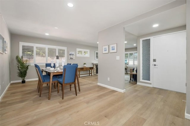 dining space with recessed lighting, baseboards, and light wood finished floors