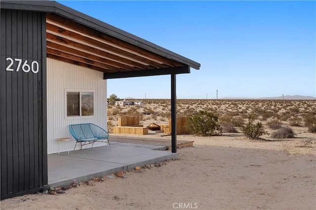 view of patio featuring fence