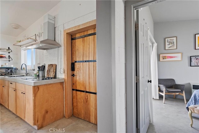 kitchen with black appliances, wall chimney range hood, concrete floors, and open shelves