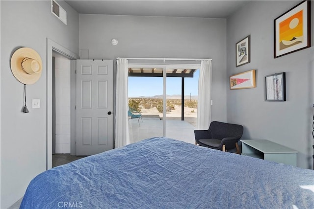 bedroom with access to outside and visible vents