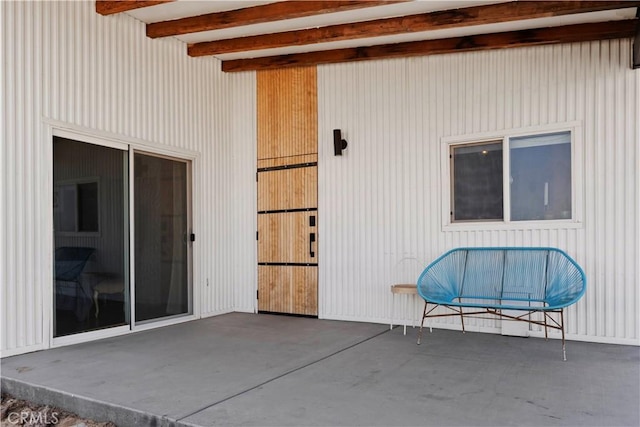 entrance to property featuring a patio area