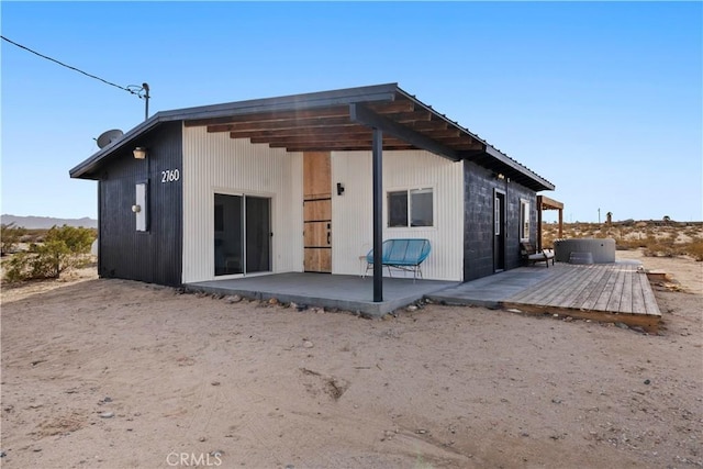 rear view of property featuring a patio area