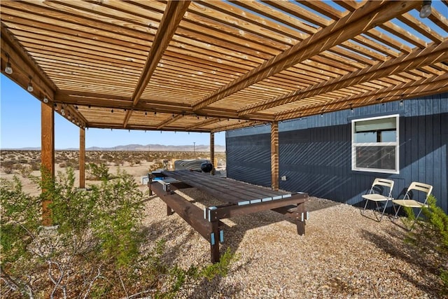 view of patio featuring a mountain view and a pergola