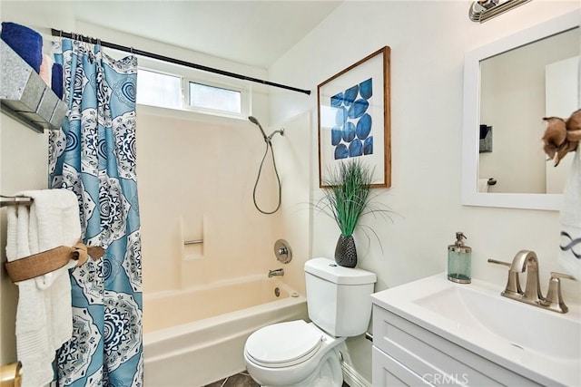 bathroom featuring vanity, toilet, and shower / bathtub combination with curtain