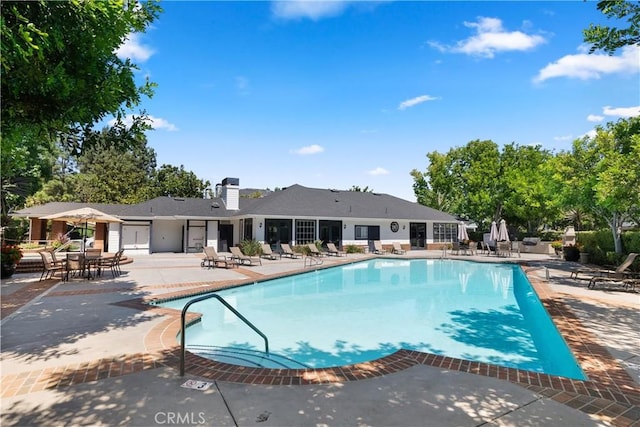 community pool featuring a patio area