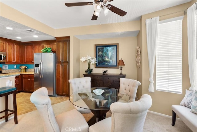 dining room featuring recessed lighting, visible vents, a ceiling fan, light carpet, and baseboards