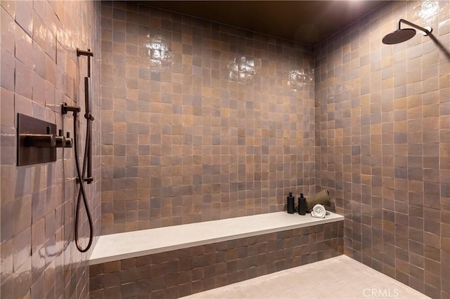 full bathroom with tiled shower