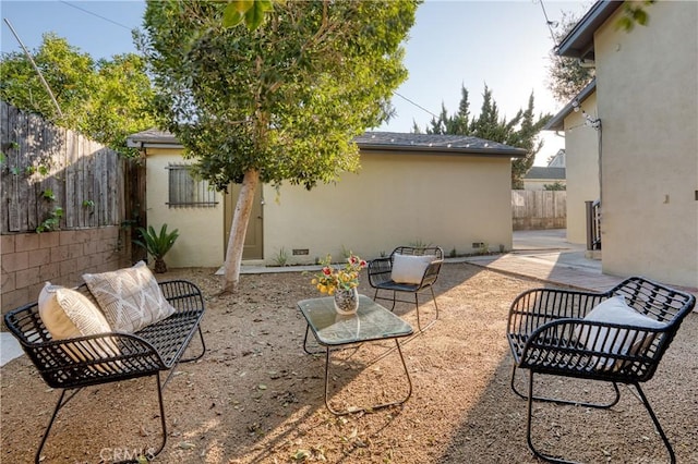 view of patio / terrace featuring fence