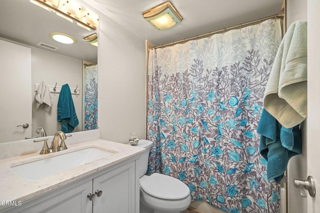 bathroom with curtained shower, visible vents, vanity, and toilet