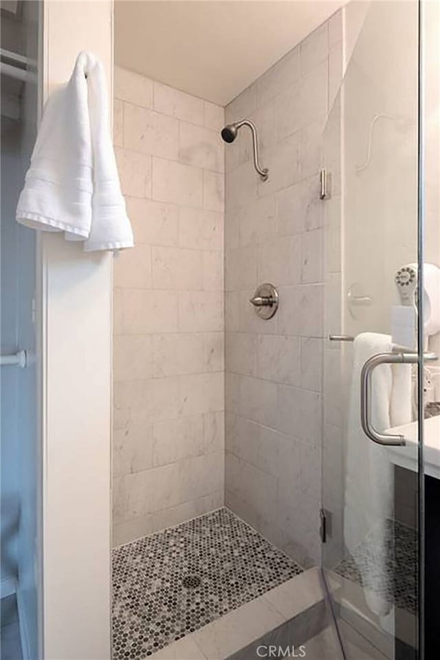 bathroom featuring a shower stall