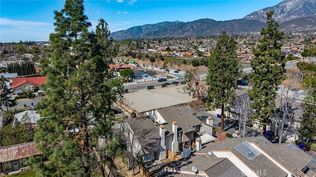 drone / aerial view featuring a residential view and a mountain view