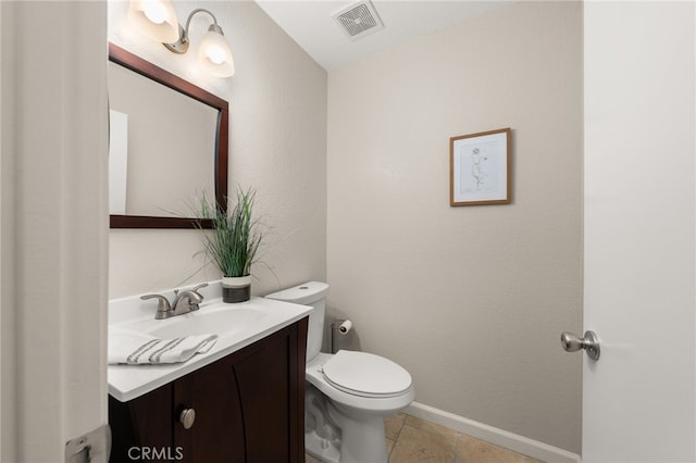 bathroom featuring baseboards, visible vents, toilet, tile patterned flooring, and vanity