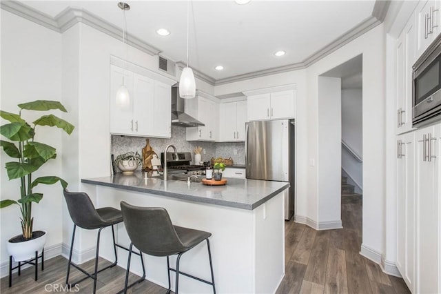 kitchen with a sink, stainless steel appliances, tasteful backsplash, and crown molding