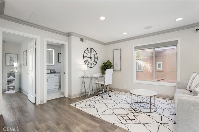 living area featuring wood finished floors, baseboards, visible vents, recessed lighting, and ornamental molding