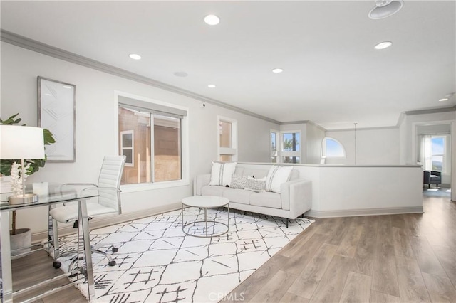 living area featuring recessed lighting, wood finished floors, and ornamental molding