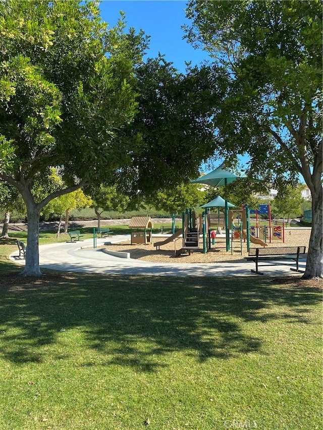 community play area with a lawn