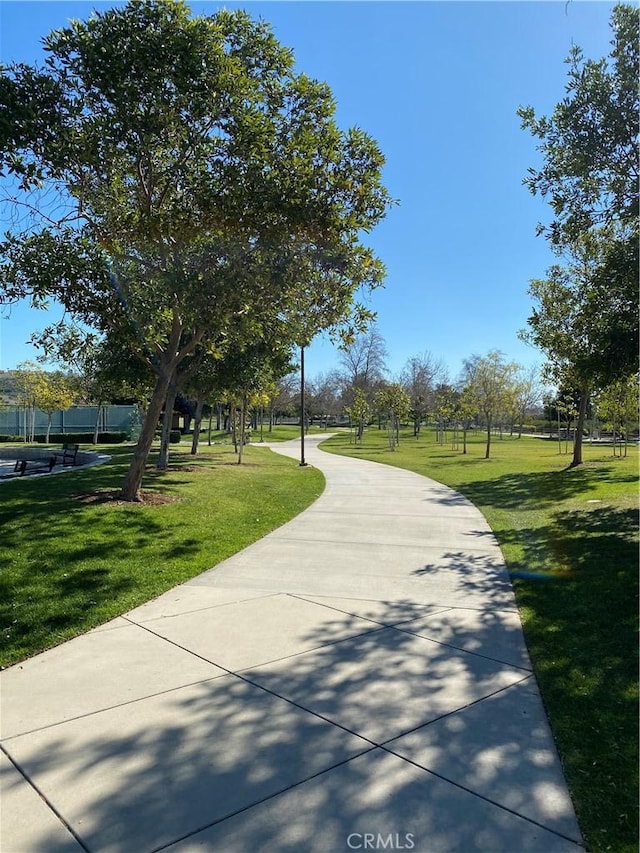 view of property's community with a yard