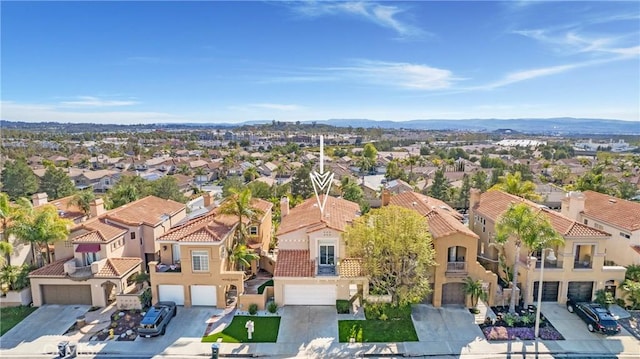 drone / aerial view with a residential view and a mountain view